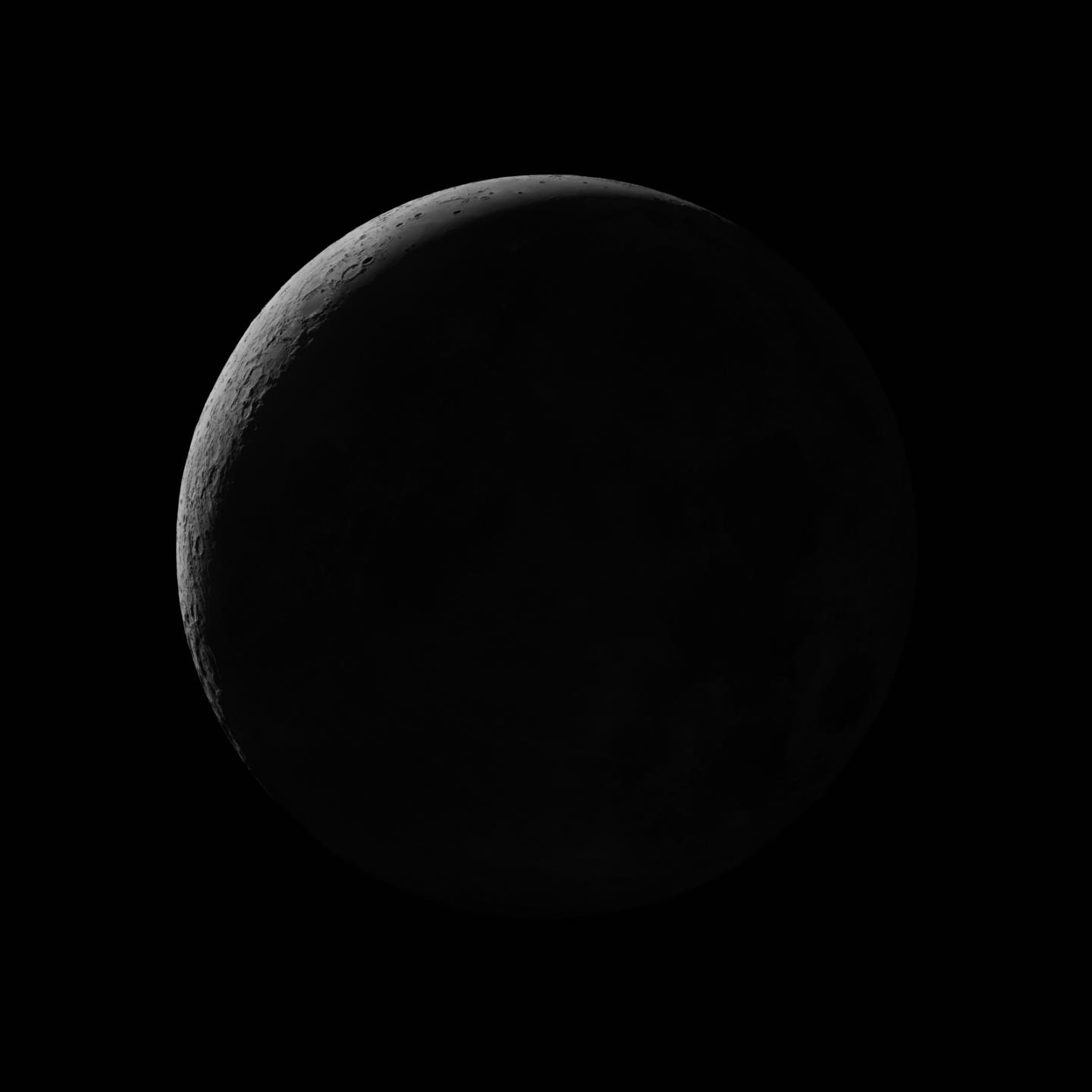 Dark photograph of a crescent Moon