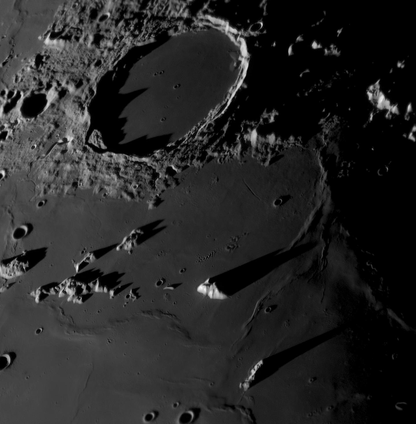 High-contrast view of the Moon’s Plato Crater and the surrounding terrain during a local lunar sunset